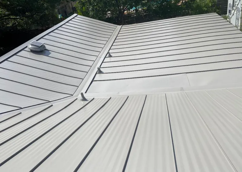 Solar attic fan installed on a metal roof for Roof Ventilation in Gurnee